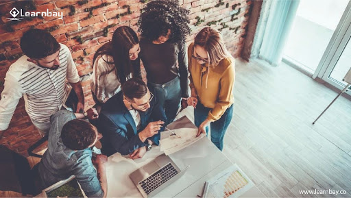 A group of  data science working professionals are busy in  discussion.