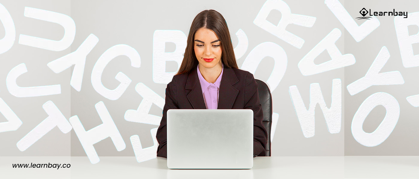 A professional seated in front of a laptop learns the process of handwriting recognition.