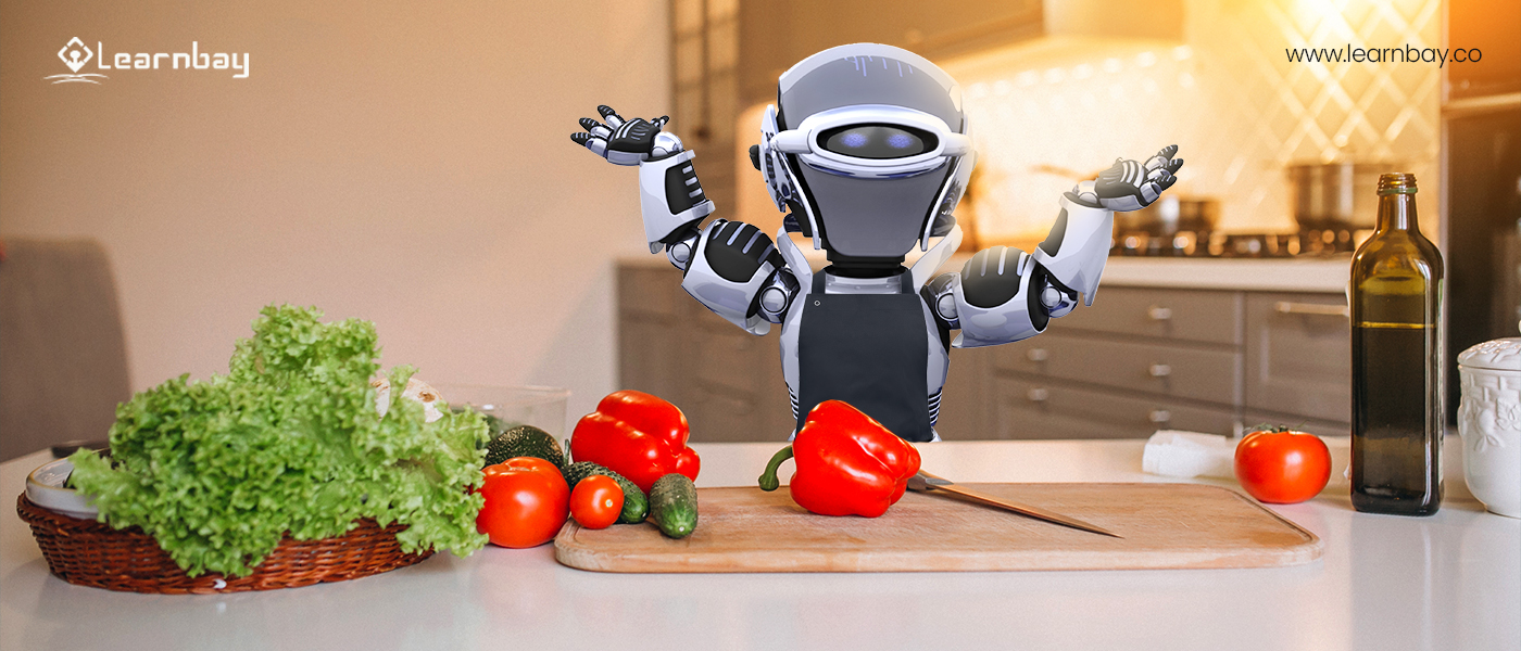 A robot chef inside the kitchen, standing in front of a chopping board with vegetables and a knife.