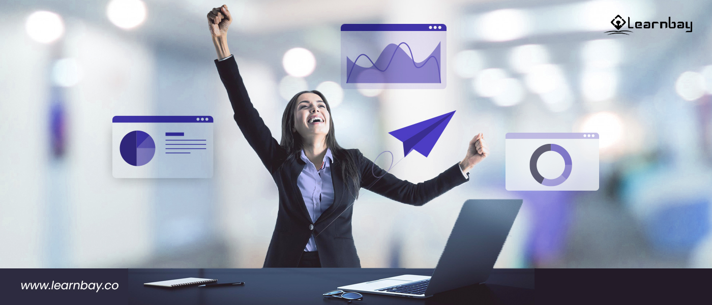 A woman stands in front of a laptop, cheering and utilizing data science tools for quicker optimization.