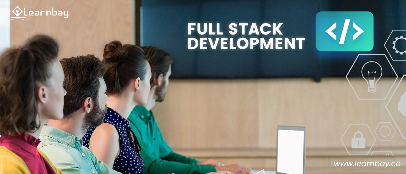 An photo shows a group of the full stack enthusiasts attending a class. They looks towards a screen diplaying, 'Full Stack Development </>'