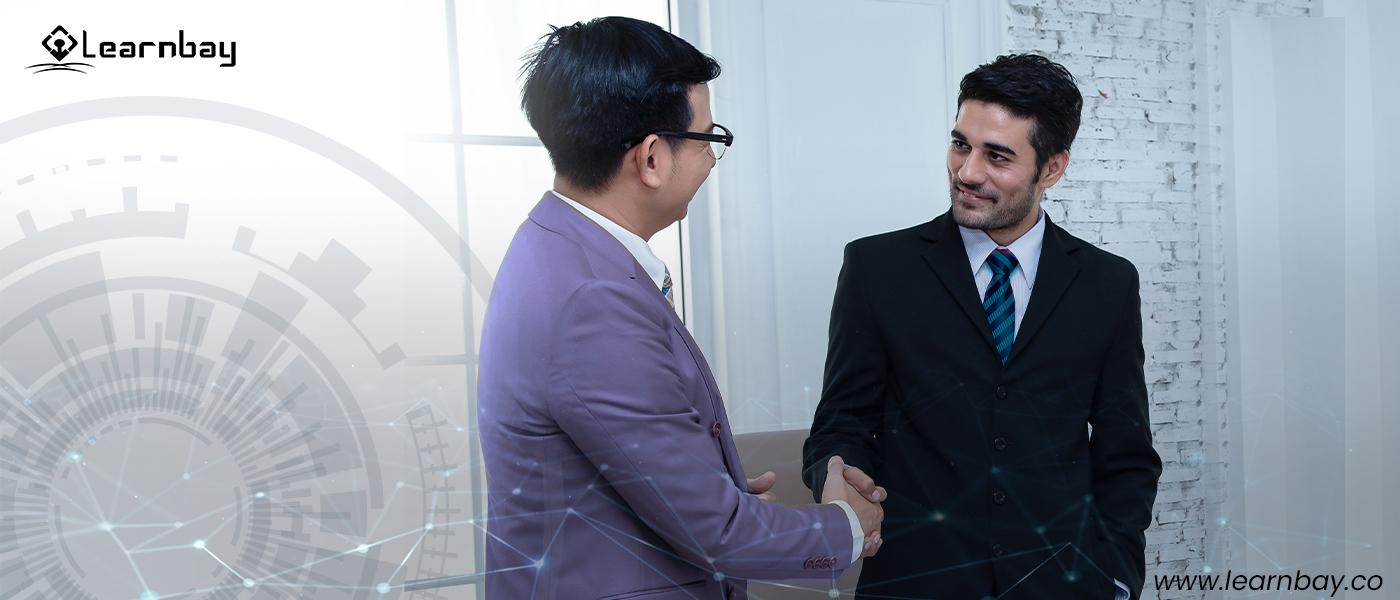 Two full-stack software developers shaking hands.