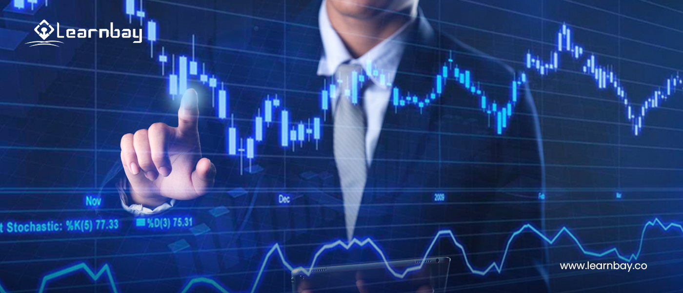 An image shows a professional pointing to a large screen that displays various data analysis for forecasting.