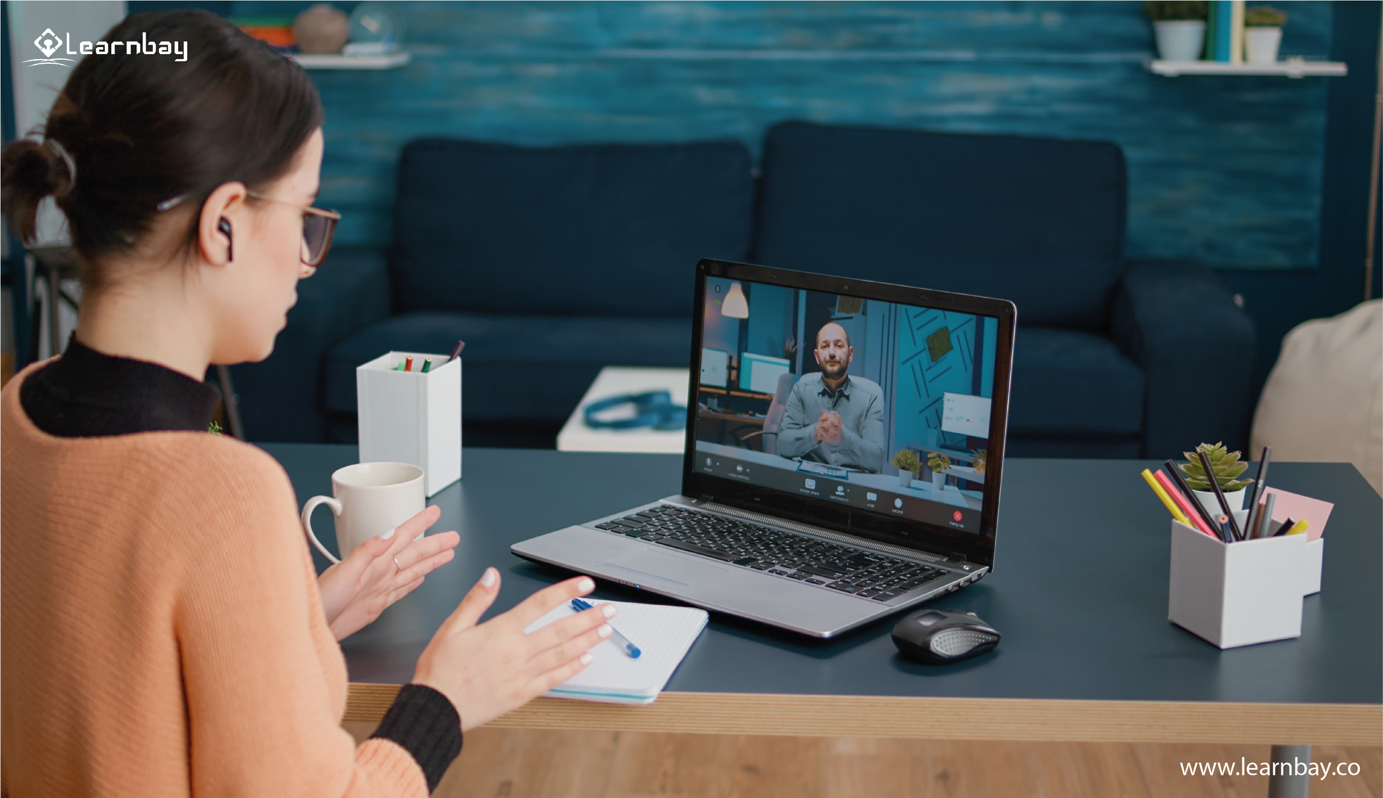 A woman seated in front of her laptop undergoes an online Data Science course.